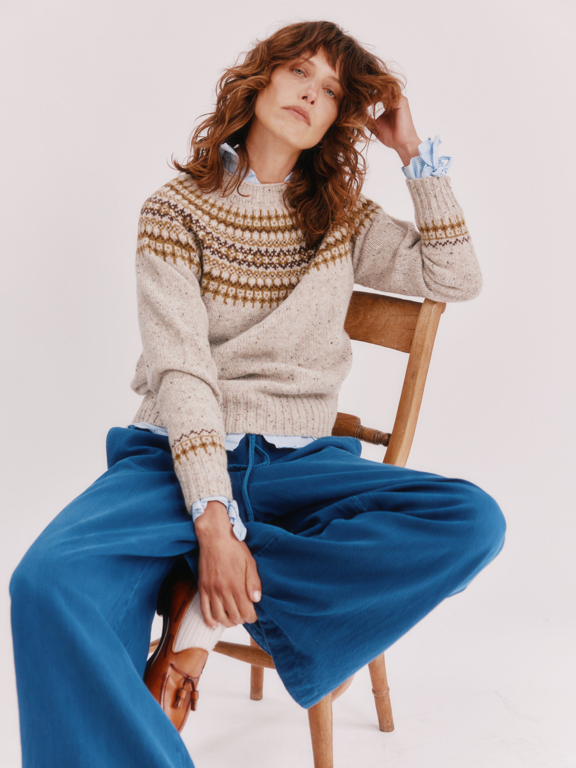 Model wearing a Bosie Knitwear Islander Yoke Fair Isle Glenugie Nep Women's Sweater in colour Mull Natural.