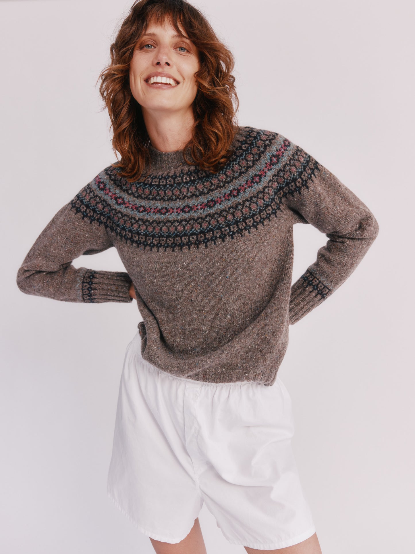 Model wearing a Bosie Knitwear Islander Yoke Fair Isle Glenugie Nep Women's Sweater  in colour Torridon Grey.