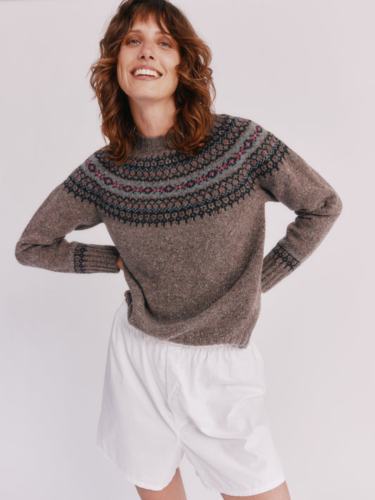 Model wearing a Bosie Knitwear Islander Yoke Fair Isle Glenugie Nep Women's Sweater  in colour Torridon Grey.