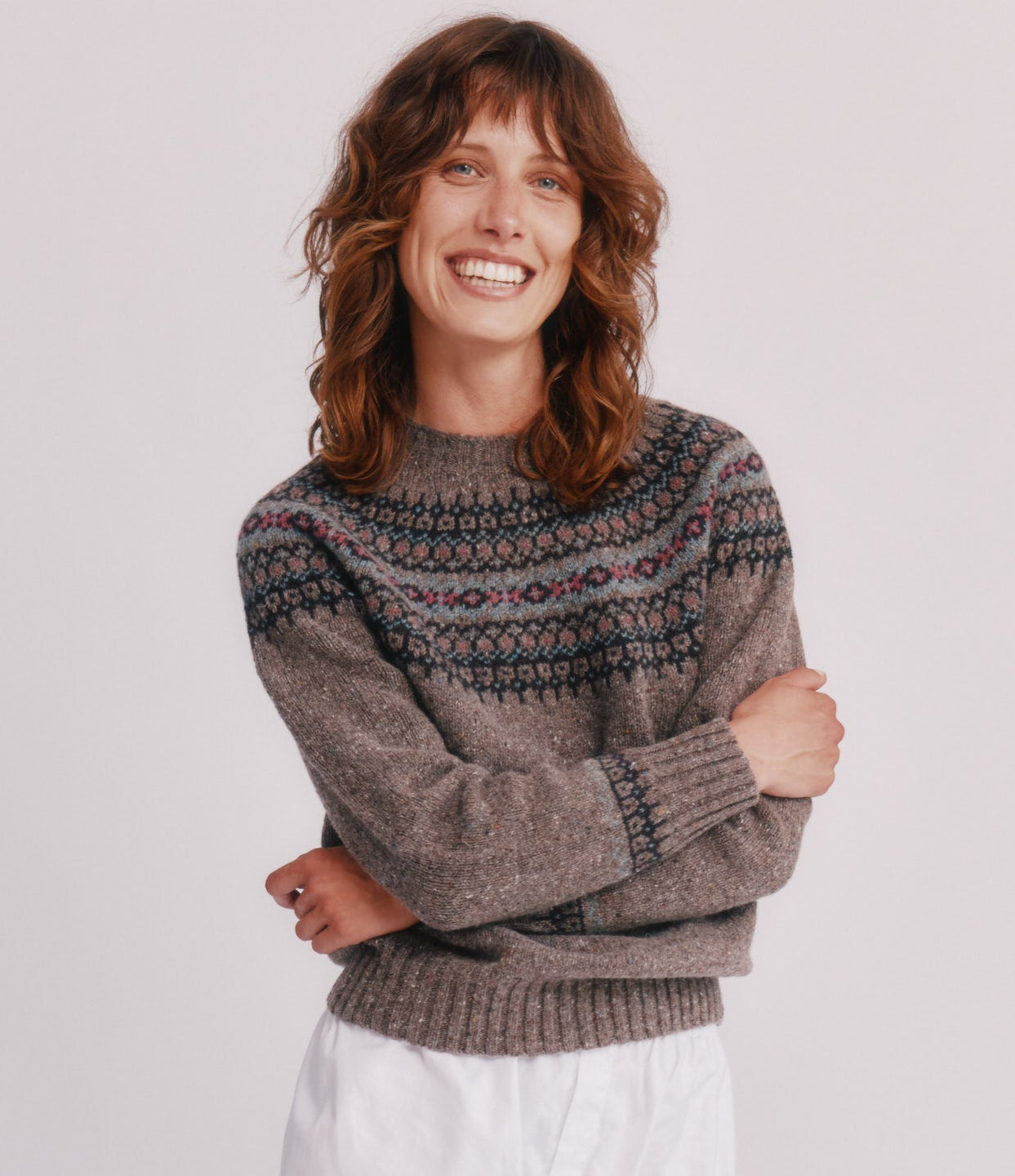 Model wearing a Bosie Knitwear Islander Yoke Fair Isle Glenugie Nep Women's Sweater  in colour Torridon Grey.