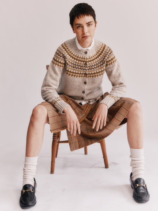 Model wearing a Bosie Knitwear Islander Yoke Fair Isle Glenugie Women's Cardigan in colour Mull Natural.