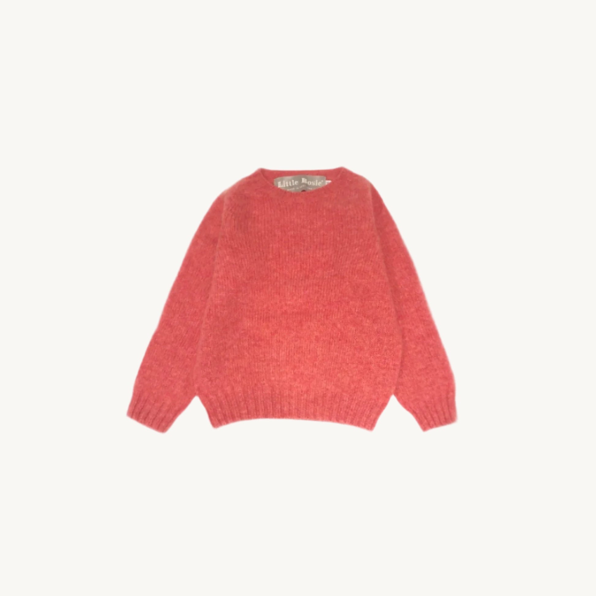 Flatbed photograph of a Bosie Little Bosie Childs Island Shetland Sweater in Rosebud Pink
