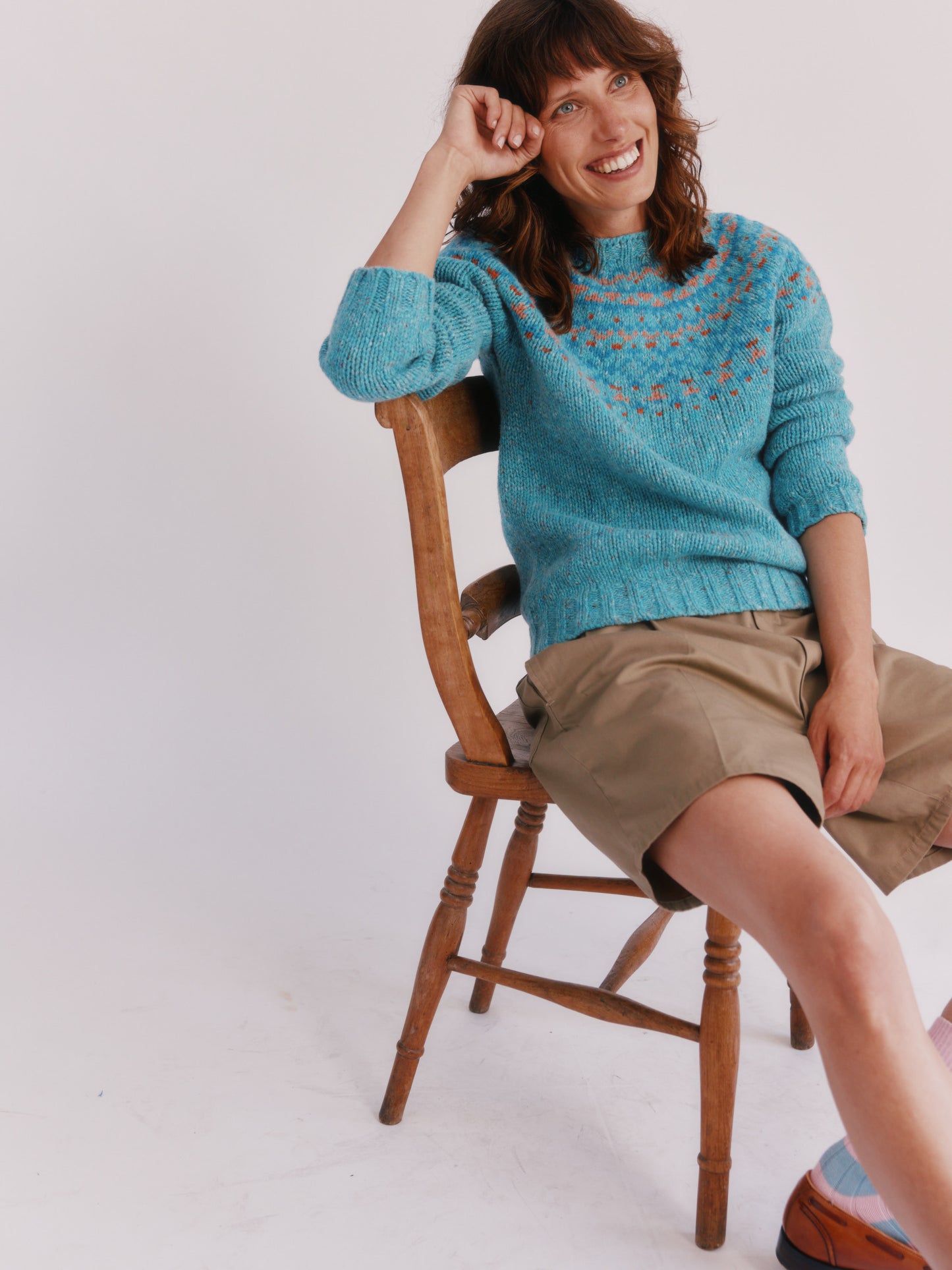 Model wearing a Bosie Knitwear Luskentyre Chunky Fair Isle Glenugie Nep Women's Sweater in colour Uist Blue.