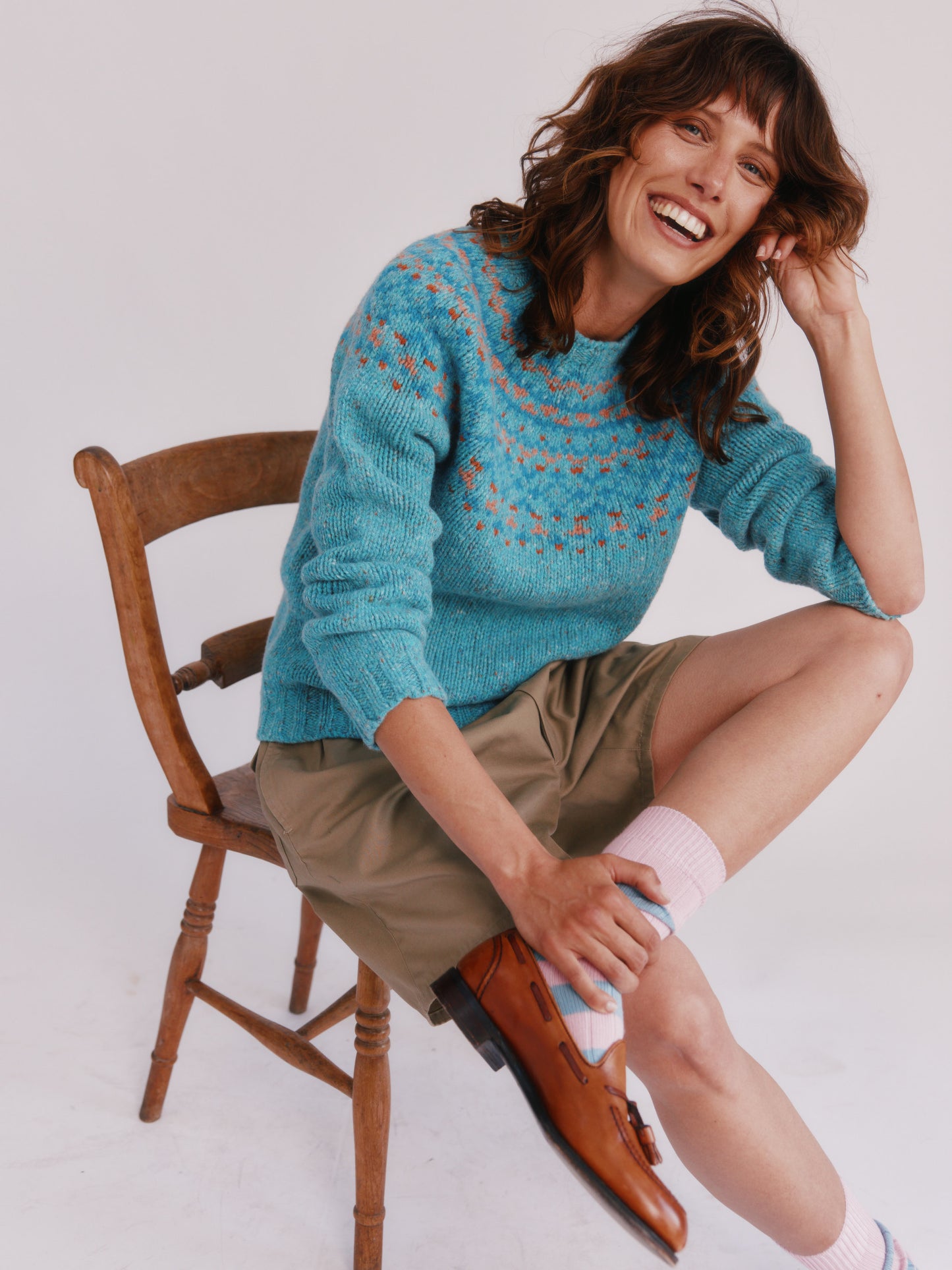 Model wearing a Bosie Knitwear Luskentyre Chunky Fair Isle Glenugie Nep Women's Sweater in colour Uist Blue.
