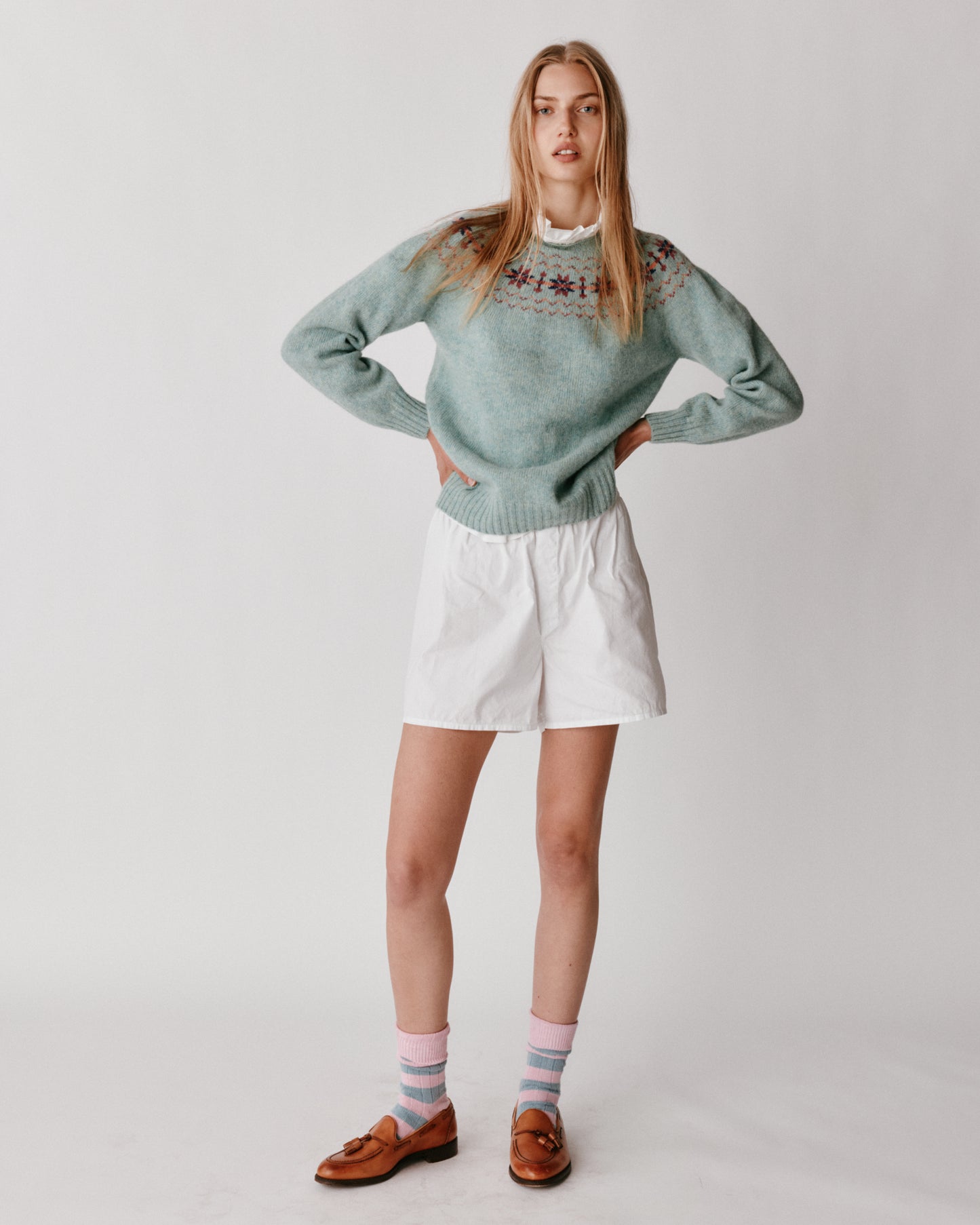 A model wearing a Bosie Murron Yoke Fair Isle Women's Sweater in colour Fauna/Opal.