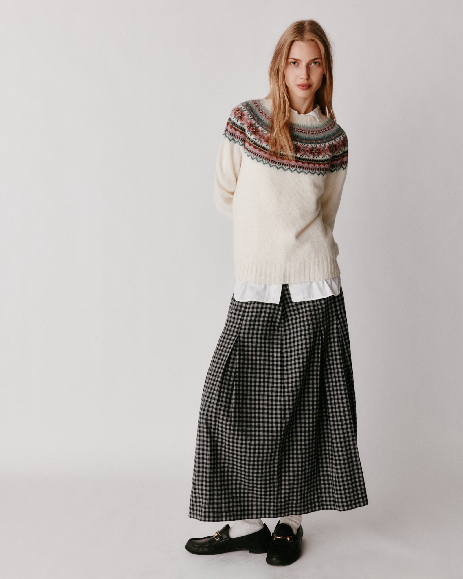 A model wearing a Bosie Sorcha Yoke Fair Isle Women's Sweater in colour White.