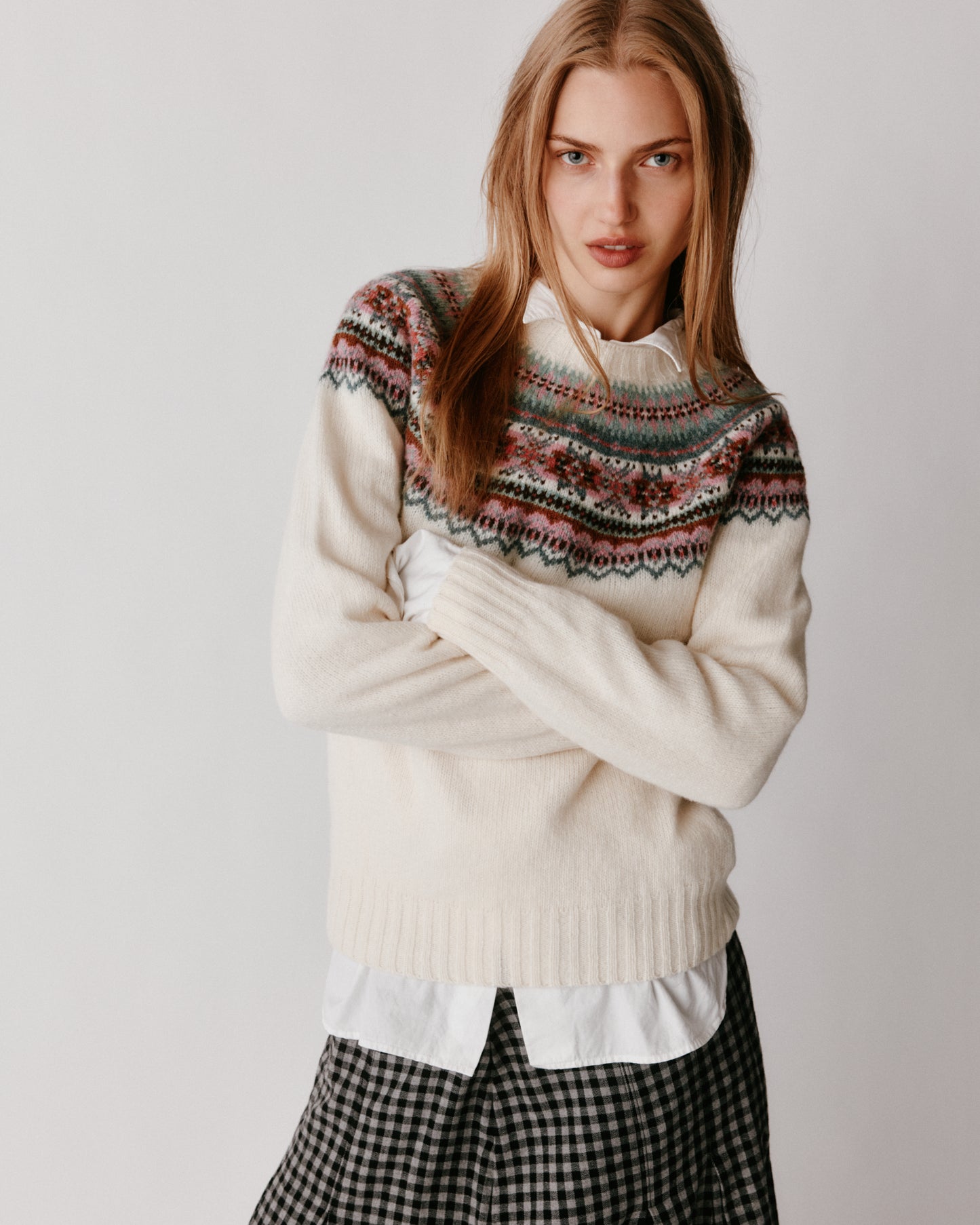 A model wearing a Bosie Sorcha Yoke Fair Isle Women's Sweater in colour White.