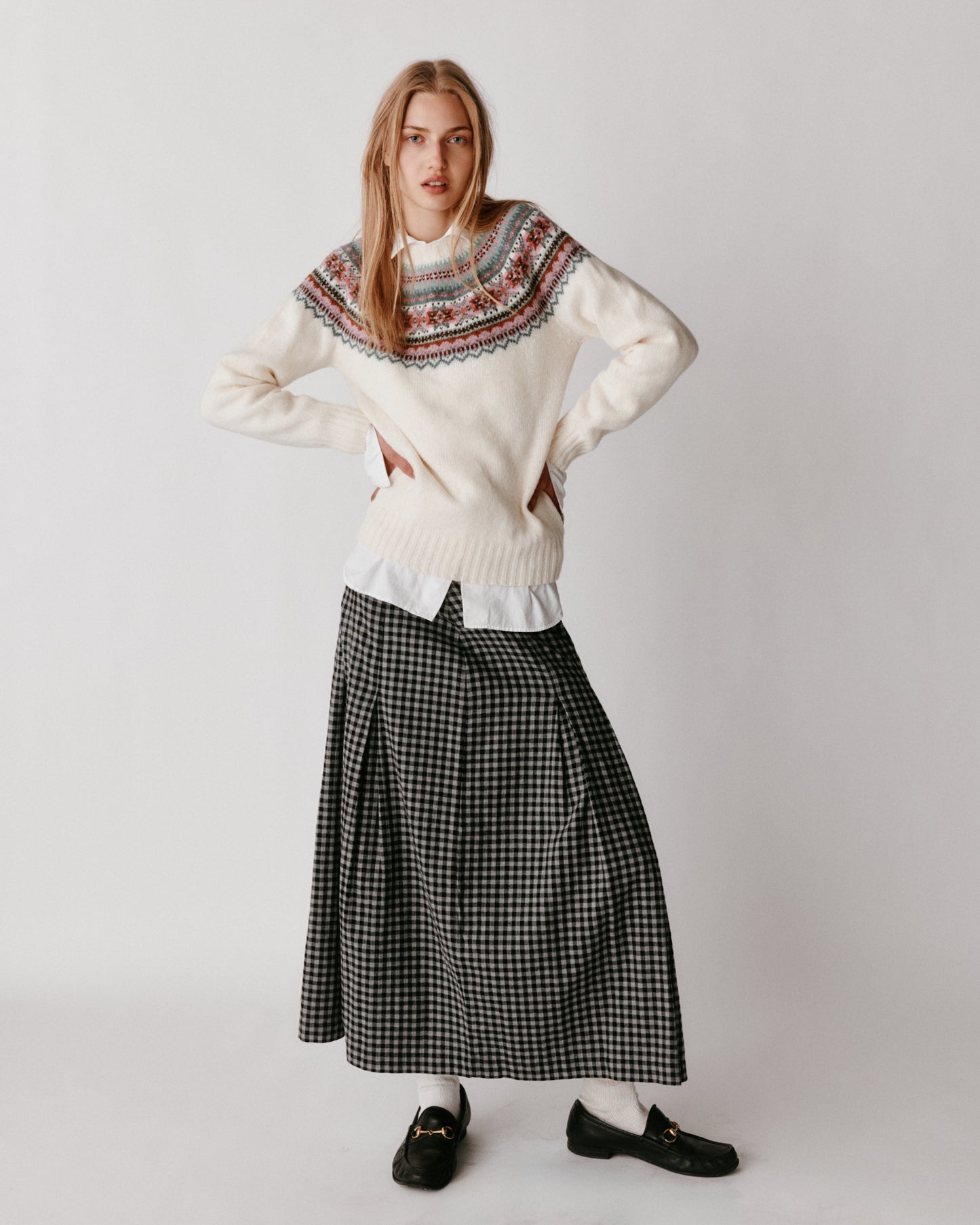 A model wearing a Bosie Sorcha Yoke Fair Isle Women's Sweater in colour White.