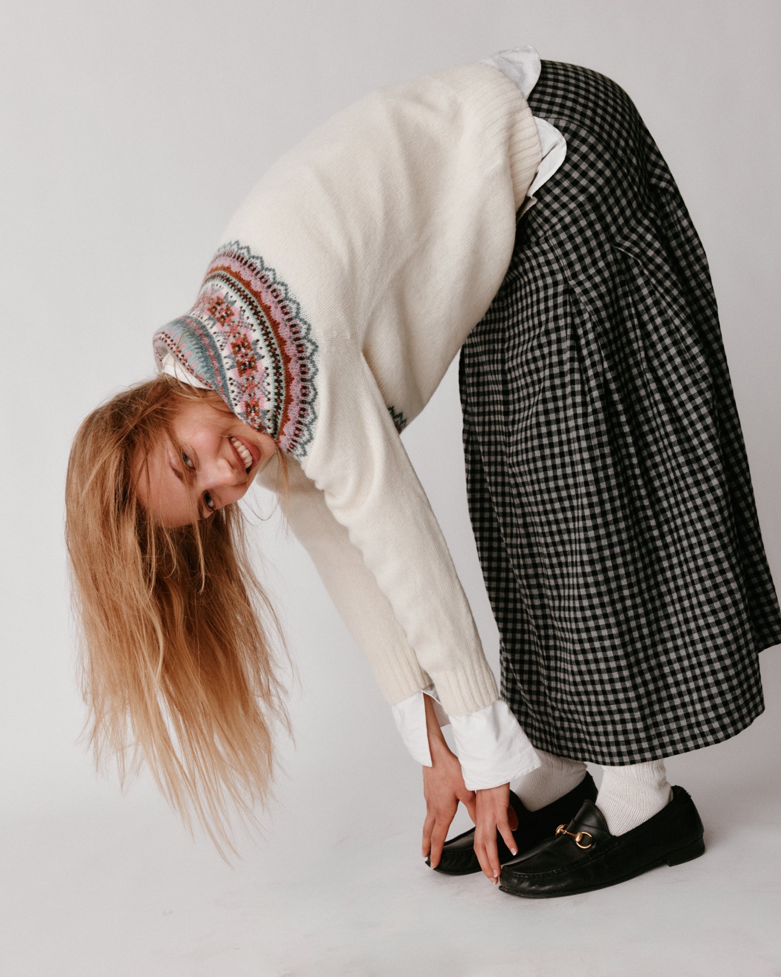 A model wearing a Bosie Sorcha Yoke Fair Isle Women's Sweater in colour White.
