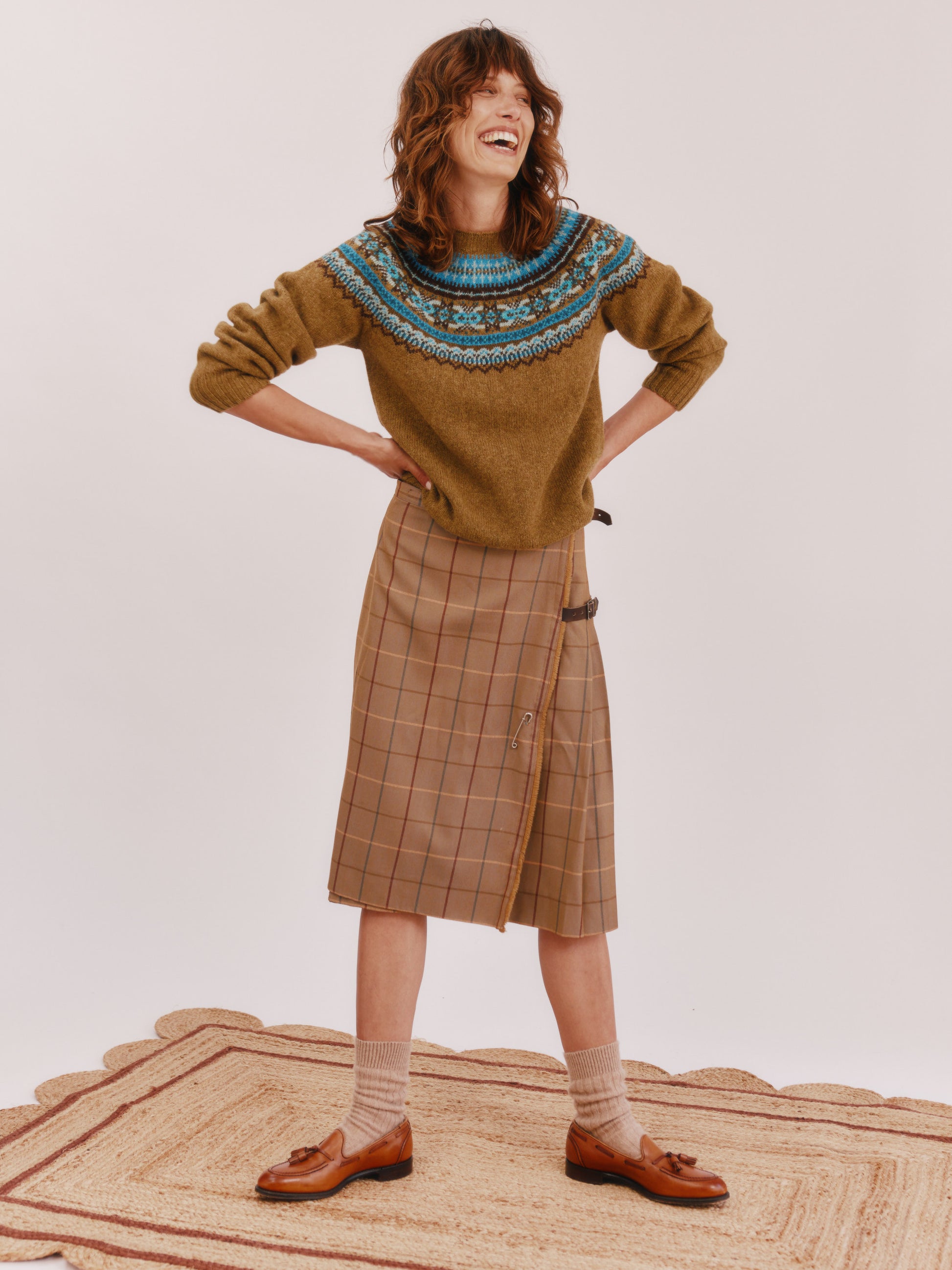 Model wearing a Bosie Knitwear Sorcha Yoke Fair Isle Women's Sweater in colour Asparagus Brown.