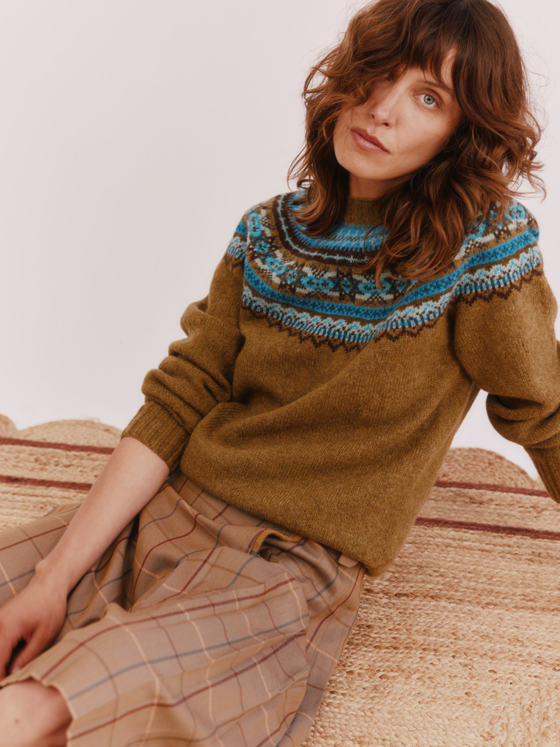 Model wearing a Bosie Knitwear Sorcha Yoke Fair Isle Women's Sweater in colour Asparagus Brown.