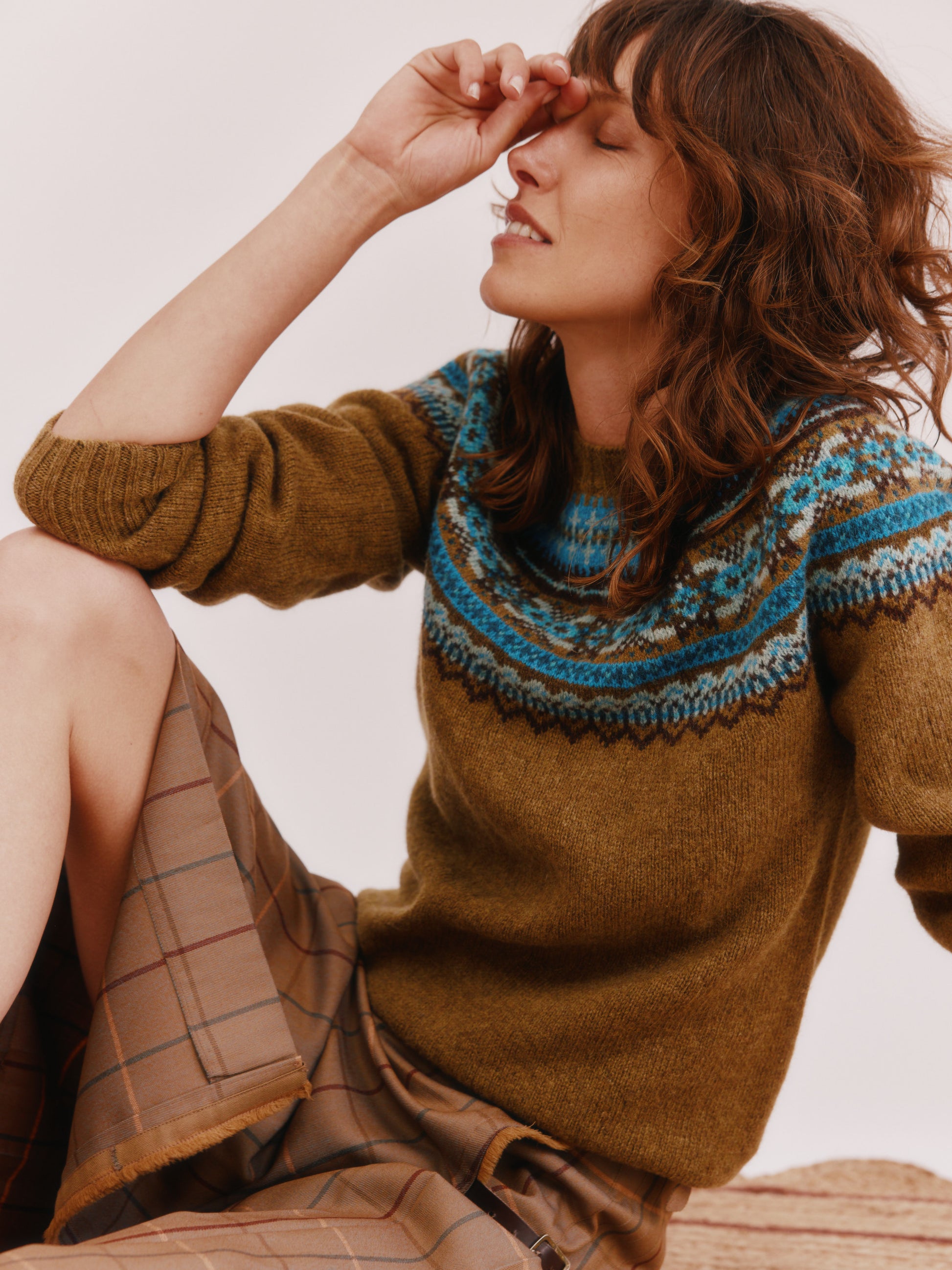 Model wearing a Bosie Knitwear Sorcha Yoke Fair Isle Women's Sweater in colour Asparagus Brown.