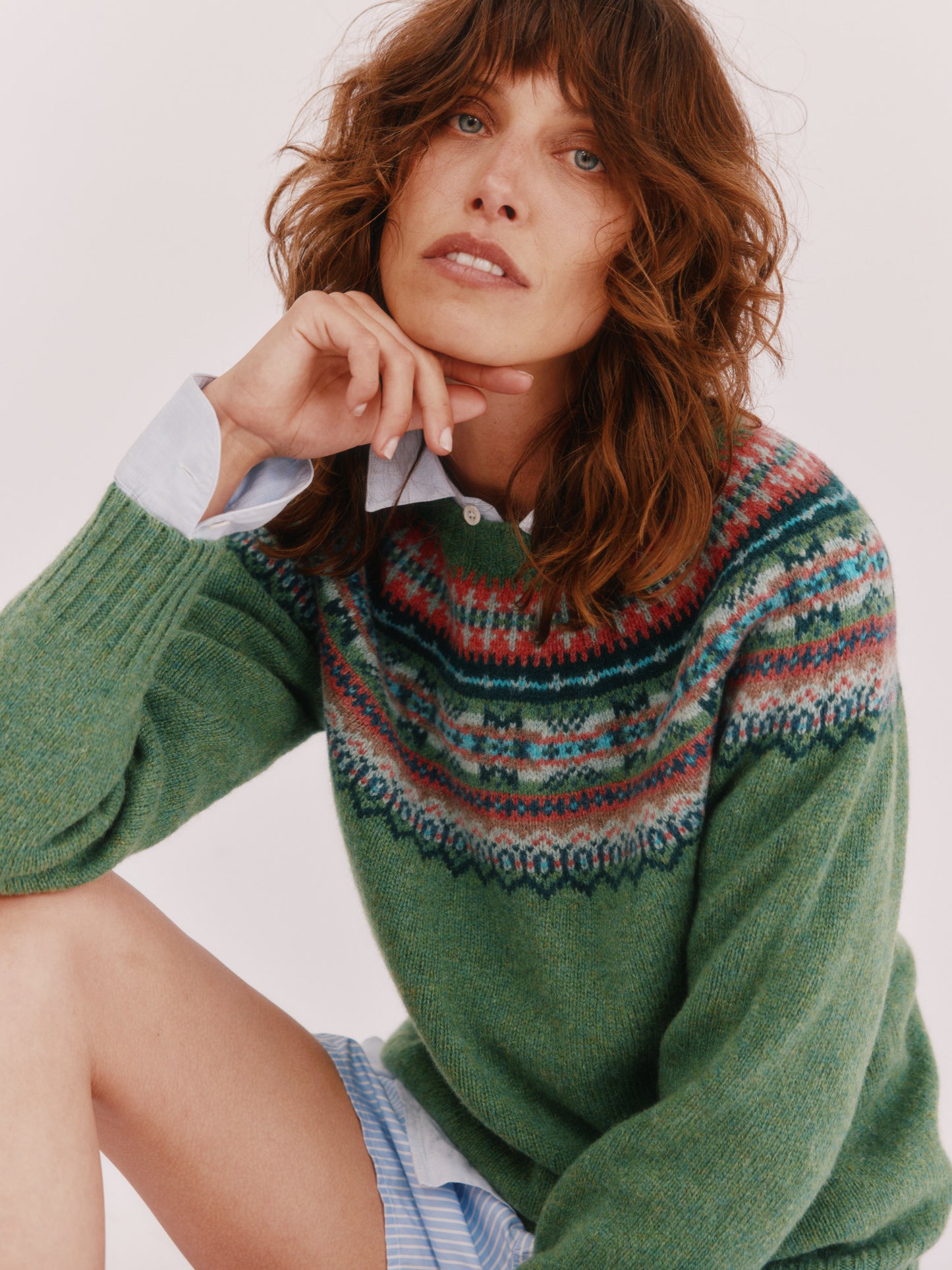Model wearing a Bosie Knitwear Sorcha Yoke Fair Isle Women's Sweater in colour Baize Green.