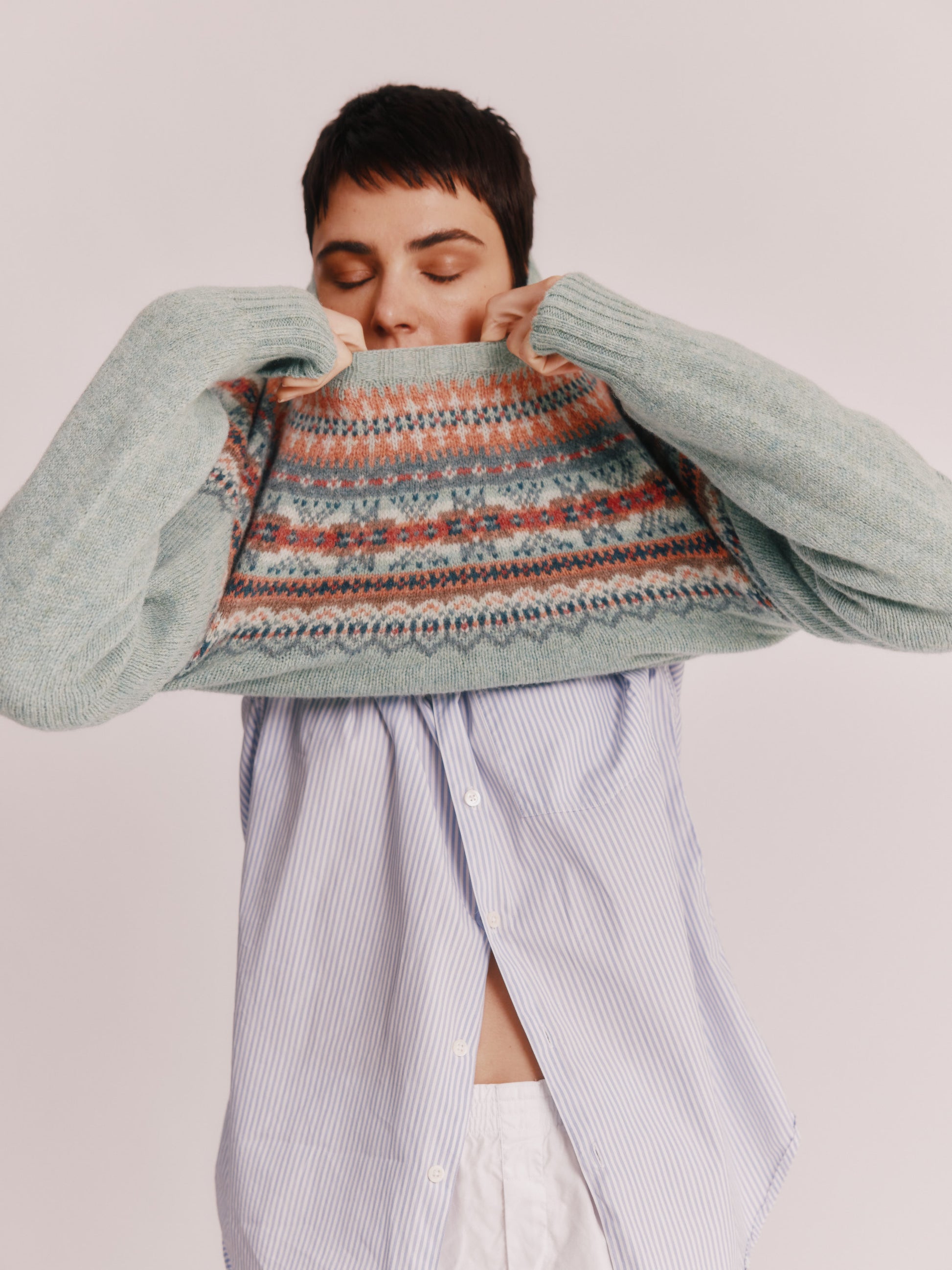 Model wearing a Bosie Knitwear Sorcha Yoke Fair Isle Women's Sweater in colour Fauna Green.