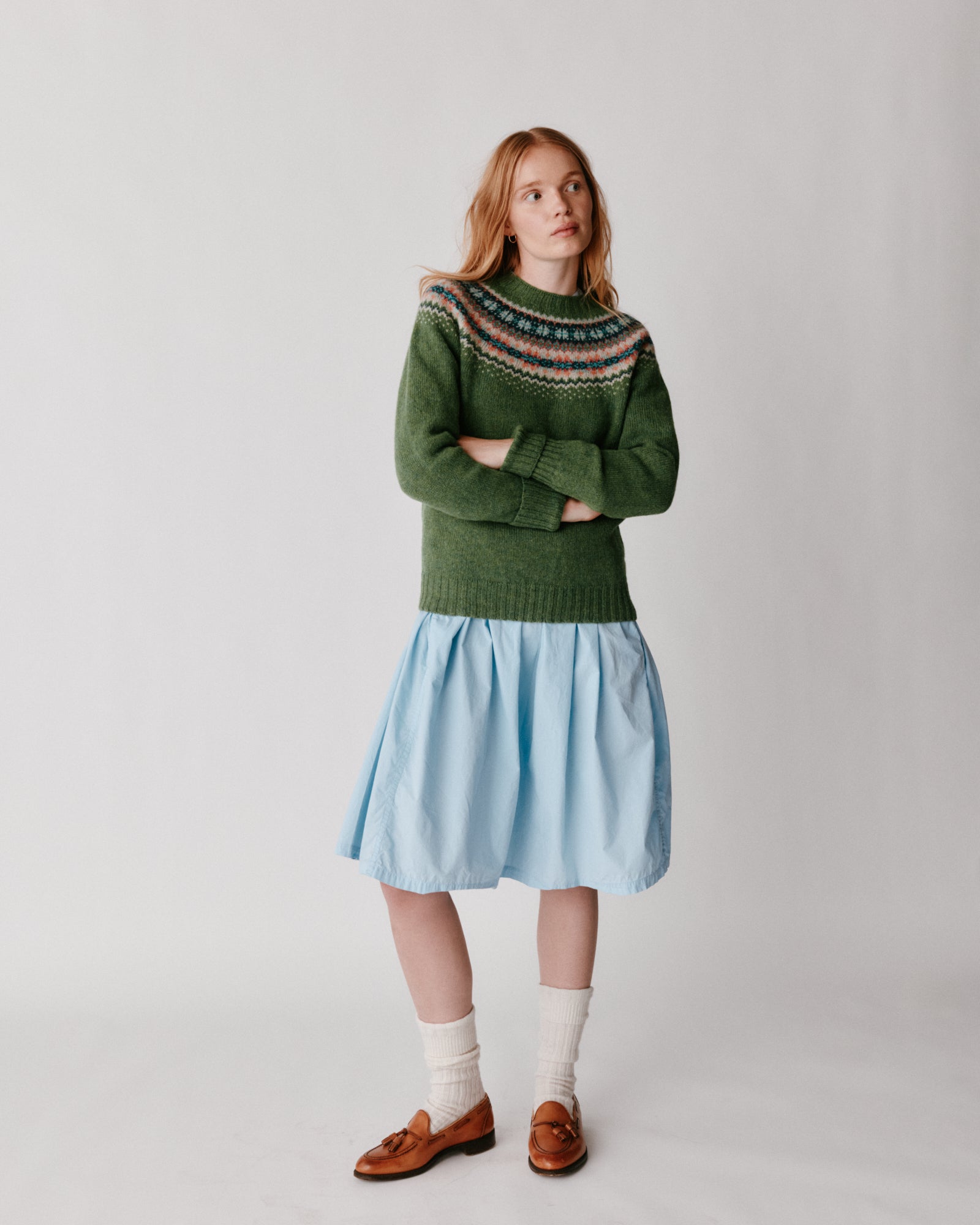 A model wearing a Bosie West Coast Yoke Fair Isle Women's Sweater in colour Baize.