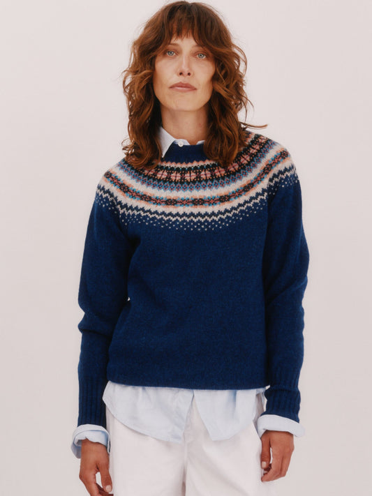 Model wearing a Bosie Knitwear West Coast Yoke Fair Isle Women's Sweater in colour Starnight Blue. Navy