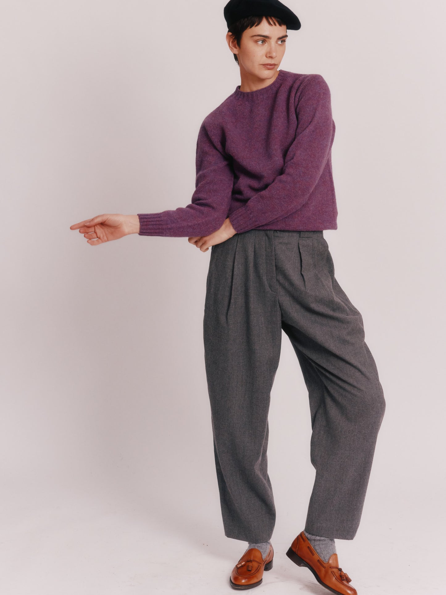 Model wearing a Womens Harley of Scotland Seamless Saddle Shoulder Shetland Sweater  in colour Calluna Purple.