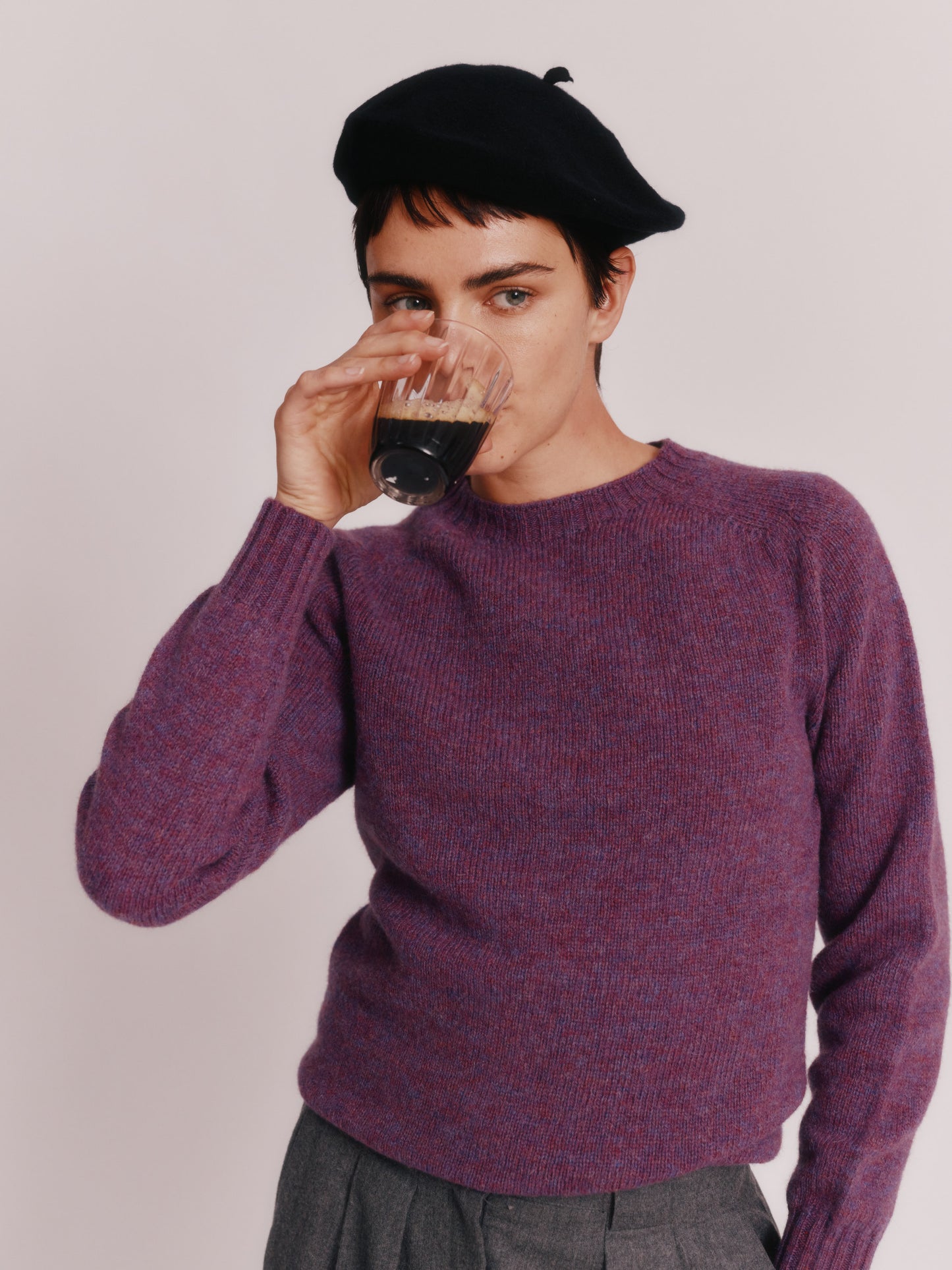 Model wearing a Womens Harley of Scotland Seamless Saddle Shoulder Shetland Sweater  in colour Calluna Purple.
