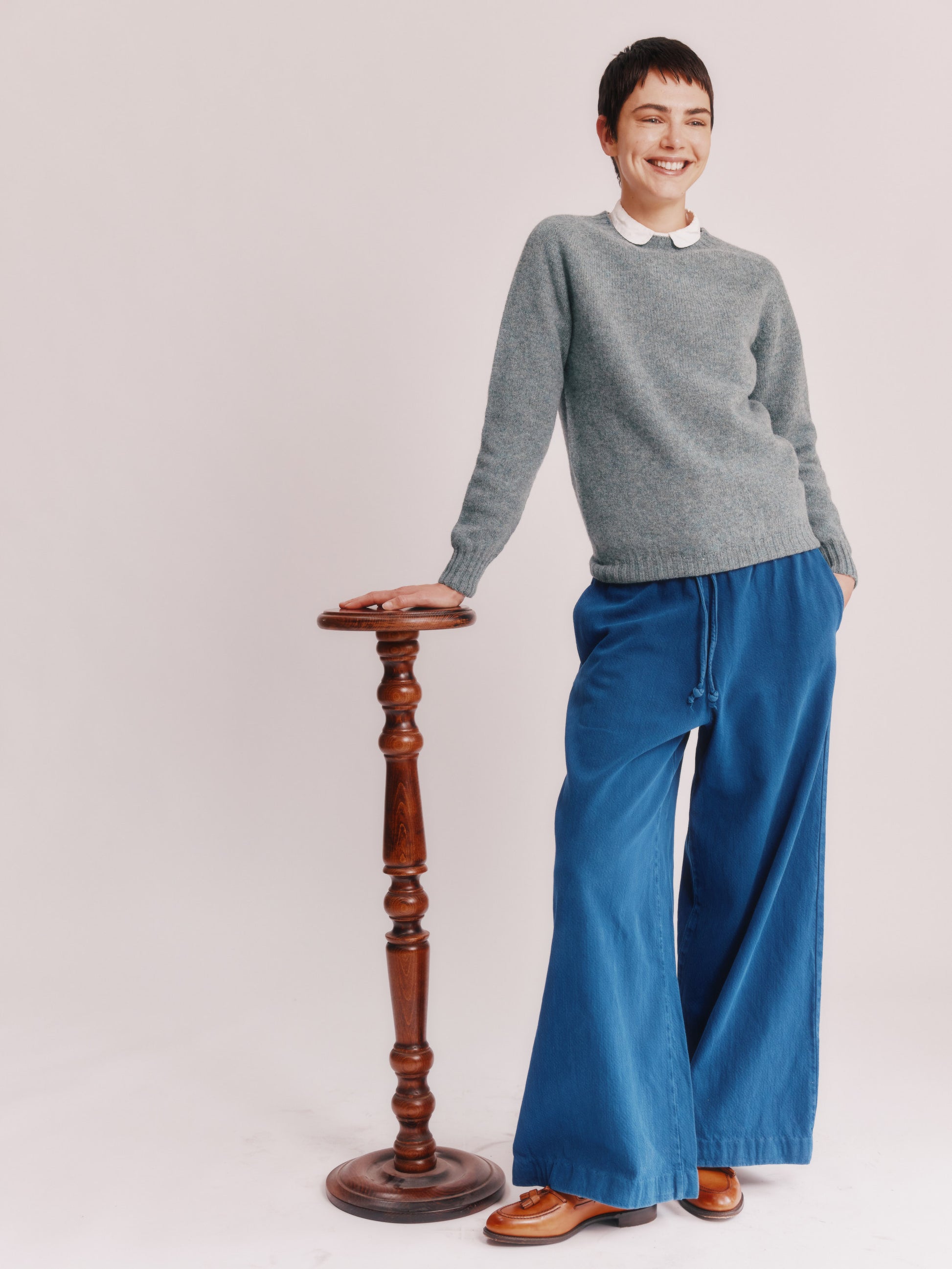 Model wearing a Bosie Knitwear Womens Harley of Scotland Seamless Saddle Shoulder Shetland Sweater in colour Graphite Green.