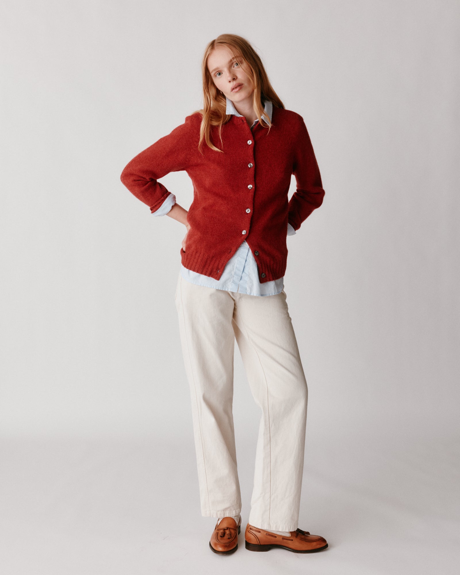 A model wearing a Bosie Womens Harley of Scotland Shetland Crew Neck Cardigan in colour Framboise.