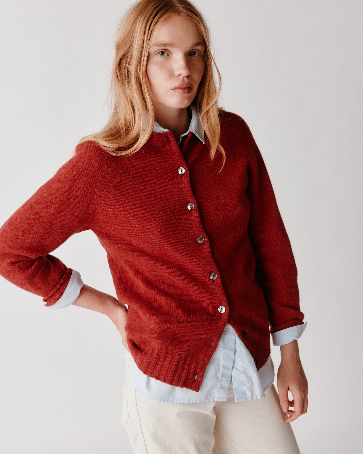 A model wearing a Bosie Womens Harley of Scotland Shetland Crew Neck Cardigan in colour Framboise.