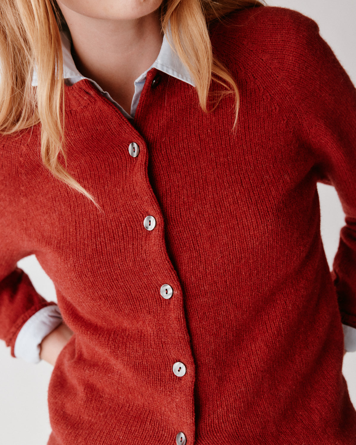 A model wearing a Bosie Womens Harley of Scotland Shetland Crew Neck Cardigan in colour Framboise.
