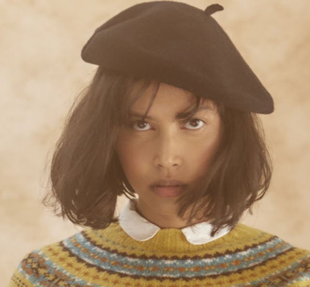 Woman wearing a black wool beret by Bosie Knitwear