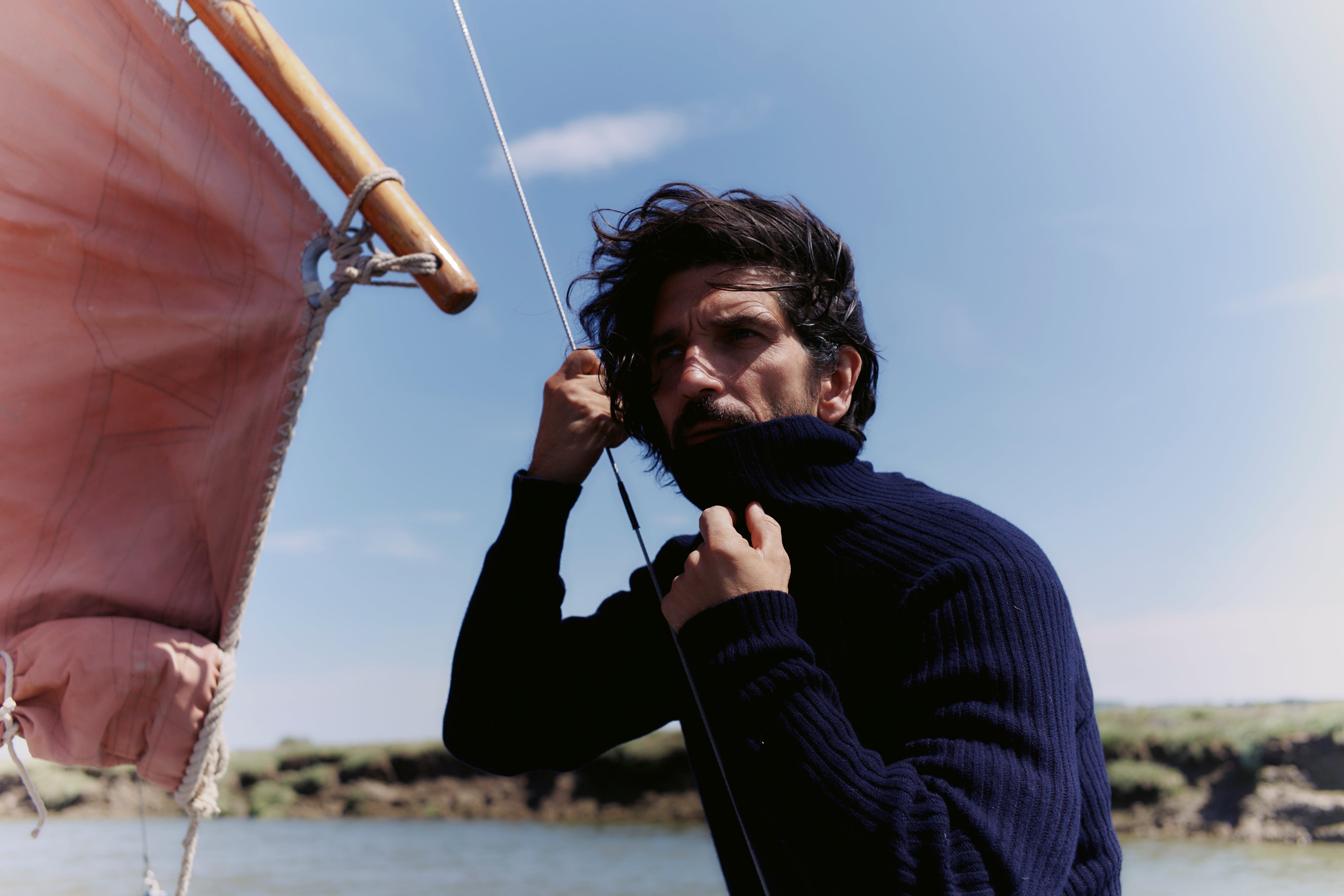 Man wearing a Blue Mogganer Diver navy ribbed polo neck Geelong Sweater by Bosie Knitwear