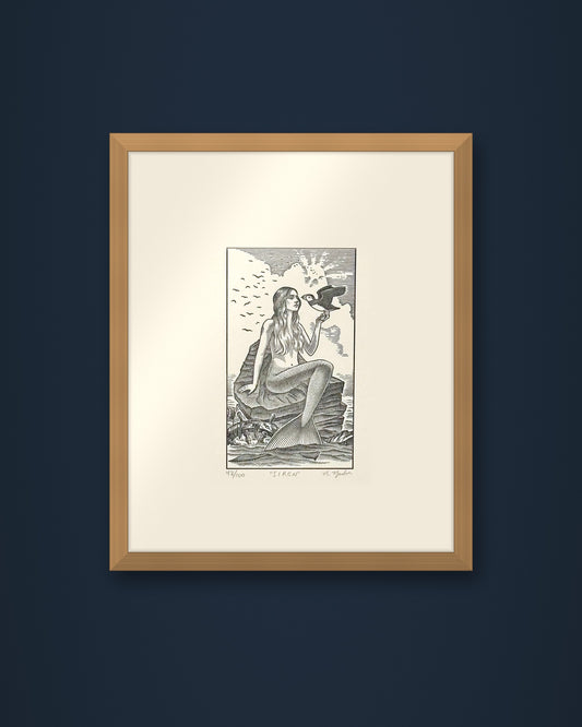 The Siren: hand-pressed, hand-signed limited edition print of Nathan Yoder's hand-drawn illustration for Bosie Knitwear's Blue Mogganer collection, shown in an oak frame on a navy wall (frame not included)
