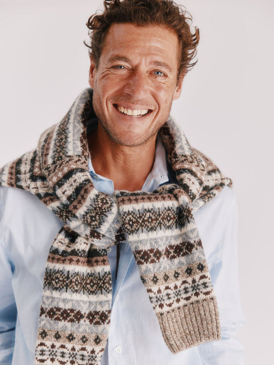 Man wearing a Blue Mogganer Mushroom Brown Crovie allover fairisle in lambswool by Bosie Knitwear